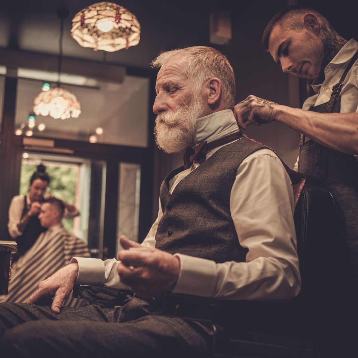 Distinguished gentleman gets his maintenance cut from his favorite Houston barber shop.