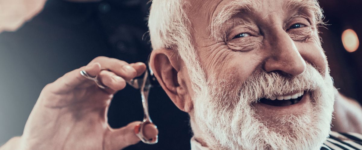 A caring Houston barber makes happy customers.